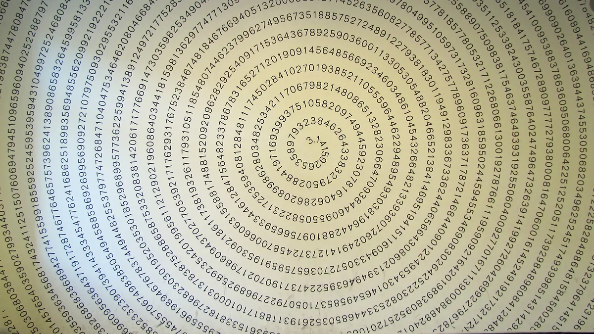 The digits of pi in a spiral on a wall at the Mathematikum in Giessen