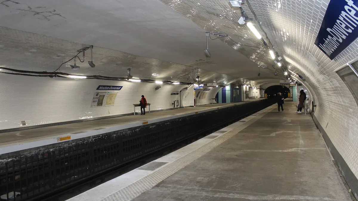 A tiled platform at Mouton-Duvernet station on the Paris Métro