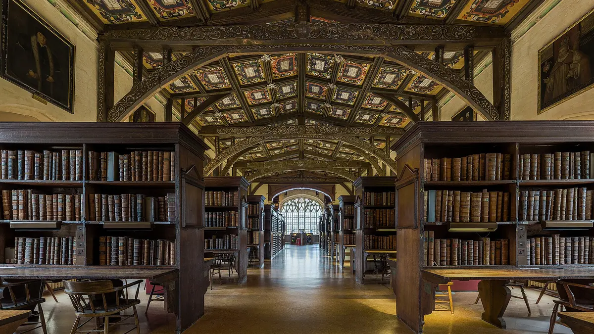 Duke Humfrey's Library in the Bodleian, with carved bookcases and a painted ceiling
